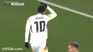 A Soccer Player Stands In Front Of A Sign That Says " Tig " GIF