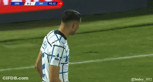 A Soccer Player Stands On The Field With The Scoreboard Showing Cro 0-2 GIF