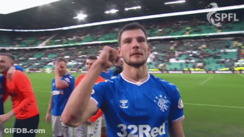 A Soccer Player Wearing A 32 Red Jersey Holds Up His Fist GIF
