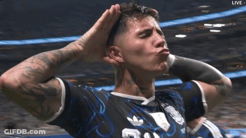 A Soccer Player Wearing A Black Adidas Jersey Holds His Hands To His Head GIF