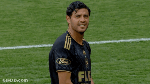 A Soccer Player Wearing A Black And Gold Jersey With The Word Flex On It GIF