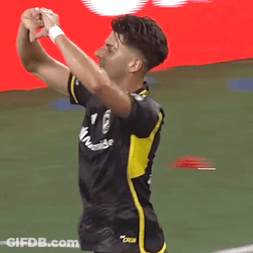 A Soccer Player Wearing A Black And Yellow Jersey That Says Oakland On It GIF