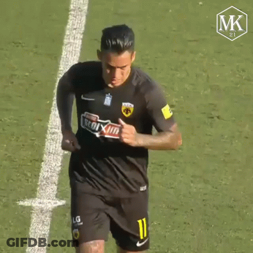 A Soccer Player Wearing A Black Jersey With The Number 11 On It GIF