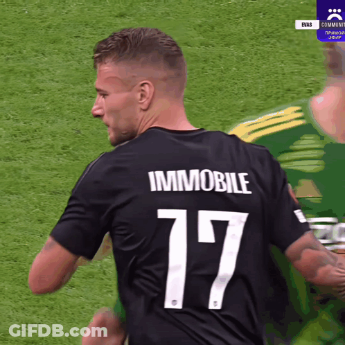 A Soccer Player Wearing A Black Jersey With The Number 17 On The Back GIF