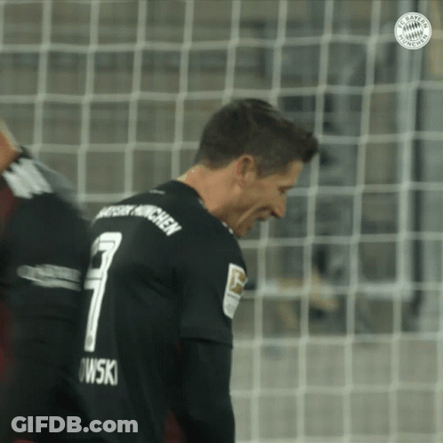 A Soccer Player Wearing A Black Jersey With The Number 7 On The Back GIF