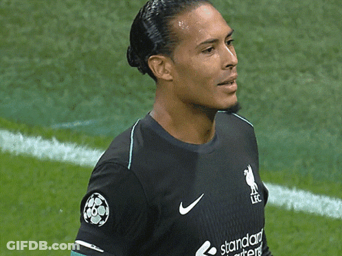 A Soccer Player Wearing A Black Jersey With The Word Standard On It GIF