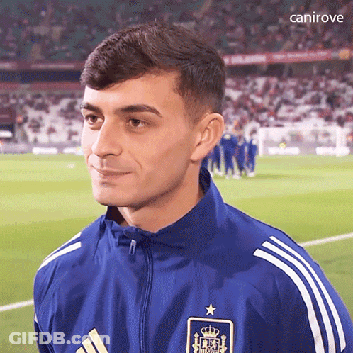 A Soccer Player Wearing A Blue Adidas Jacket With A Star On The Front GIF
