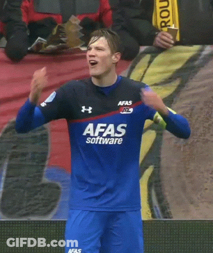 A Soccer Player Wearing A Blue Afas Software Jersey Holds His Hands To His Head GIF