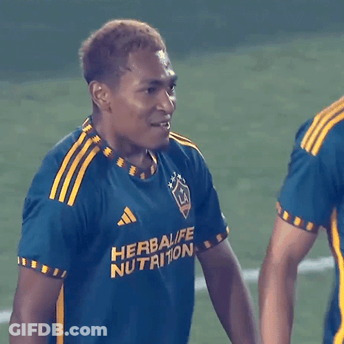 A Soccer Player Wearing A Blue And Yellow Shirt That Says Herbalife Nutrition GIF