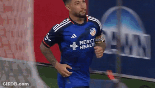 A Soccer Player Wearing A Blue Jersey That Says Merci Health On It GIF
