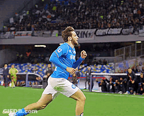 A Soccer Player Wearing A Blue Jersey With Samsung On It Is Running On The Field GIF