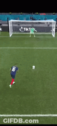 A Soccer Player Wearing A Blue Jersey With The Number 10 On The Back GIF