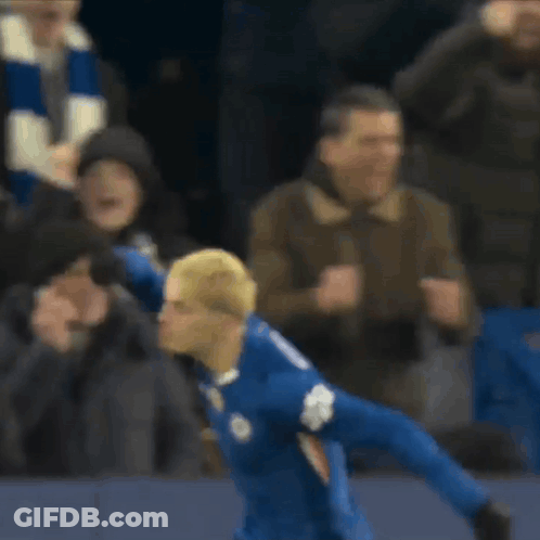 A Soccer Player Wearing A Blue Jersey With The Number 10 On The Front GIF
