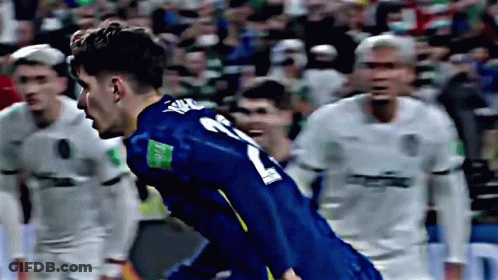 A Soccer Player Wearing A Blue Jersey With The Number 21 On The Back GIF