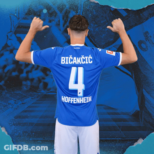 A Soccer Player Wearing A Blue Jersey With The Number 4 On It GIF