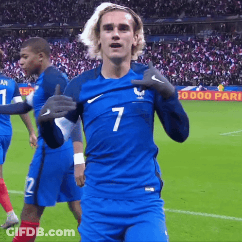 A Soccer Player Wearing A Blue Jersey With The Number 7 GIF