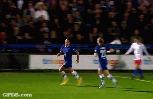 A Soccer Player Wearing A Blue Jersey With The Number 8 On It GIF