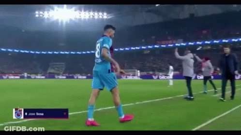 A Soccer Player Wearing A Blue Jersey With The Number 8 On It GIF