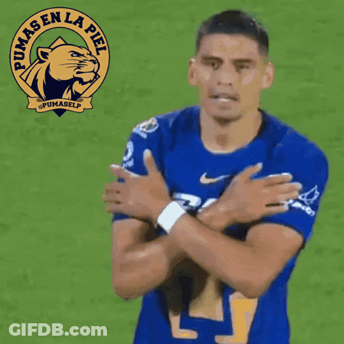 A Soccer Player Wearing A Blue Pumas En La Piel Shirt GIF