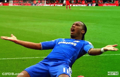 A Soccer Player Wearing A Blue Samsung Jersey With His Arms Outstretched On The Field GIF