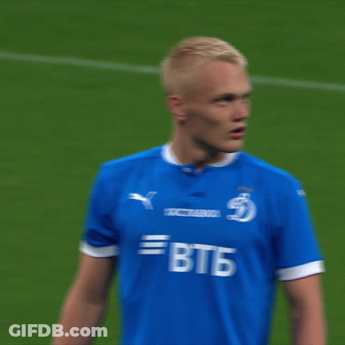 A Soccer Player Wearing A Blue Shirt With Btb On The Front GIF