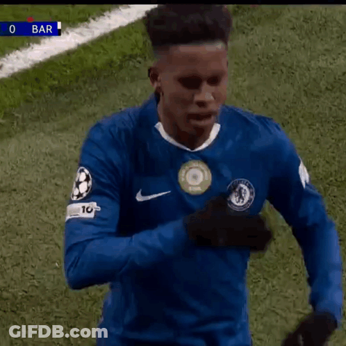 A Soccer Player Wearing A Blue Shirt With The Number 10 On It Is Standing On A Field . GIF