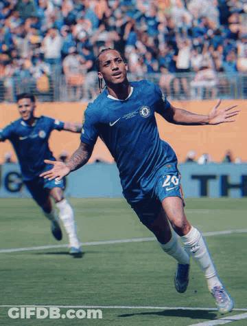 A Soccer Player Wearing A Blue Shirt With The Number 20 On It GIF