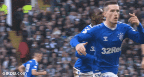 A Soccer Player Wearing A Blue Shirt With The Number 32 On The Front GIF