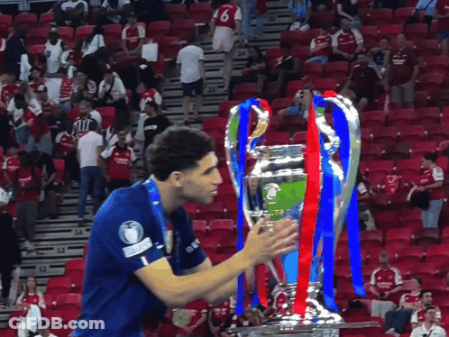 A Soccer Player Wearing A Blue Shirt With The Number 6 On It GIF