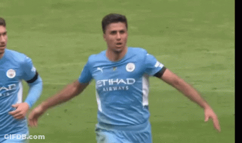 A Soccer Player Wearing A Blue Shirt With The Word Etihad Airways On It Is Running On A Field . GIF