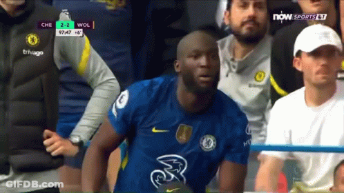 A Soccer Player Wearing A Chelsea Jersey Is Sitting In The Stands During A Game . GIF