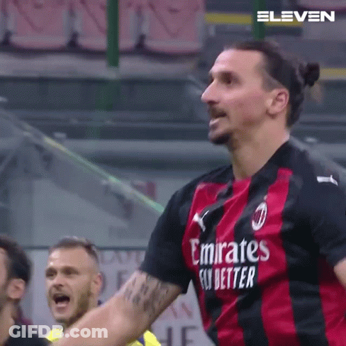 A Soccer Player Wearing A Emirates Fly Better Jersey Is Celebrating A Goal GIF