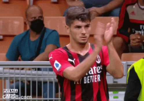 A Soccer Player Wearing A Fly Emirates Jersey Applauds The Crowd GIF