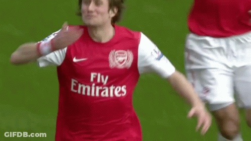 A Soccer Player Wearing A Fly Emirates Jersey Celebrates A Goal GIF