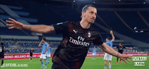 A Soccer Player Wearing A Fly Emirates Jersey Celebrates His Goal GIF