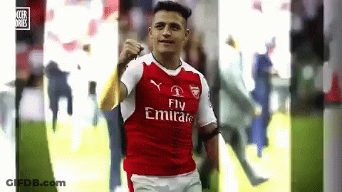A Soccer Player Wearing A Fly Emirates Jersey Is Celebrating A Goal On The Field . GIF