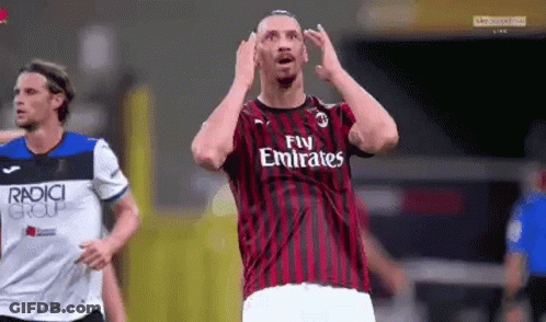 A Soccer Player Wearing A Fly Emirates Jersey Is Making A Funny Face GIF