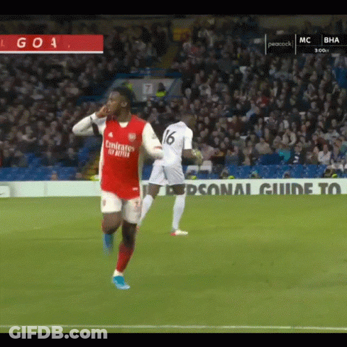 A Soccer Player Wearing A Fly Emirates Jersey Is Running On The Field GIF