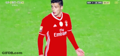 A Soccer Player Wearing A Fly Emirates Jersey Is Standing On A Field GIF