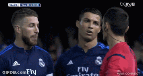 A Soccer Player Wearing A Fly Emirates Jersey Is Talking To Another Player GIF