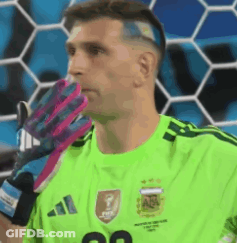 A Soccer Player Wearing A Green Adidas Jersey With The Number 20 On It GIF