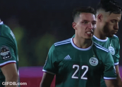 A Soccer Player Wearing A Green Adidas Jersey With The Number 22 On It GIF