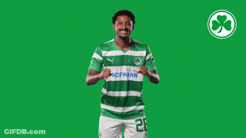 A Soccer Player Wearing A Green And White Jersey With The Number 20 GIF