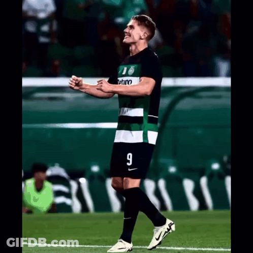 A Soccer Player Wearing A Green And White Jersey With The Number 9 On It GIF