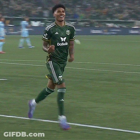 A Soccer Player Wearing A Green And Yellow Jersey With The Letter T On It GIF