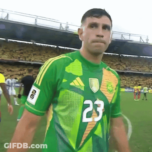 A Soccer Player Wearing A Green And Yellow Jersey With The Number 23 On It GIF