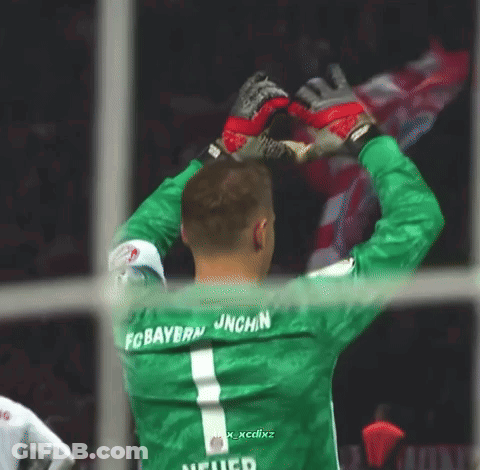 A Soccer Player Wearing A Green Jersey That Says Fc Bayern On The Back GIF