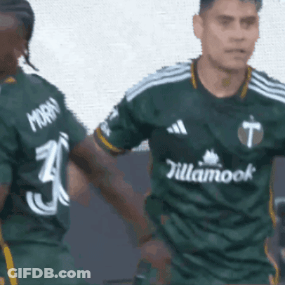 A Soccer Player Wearing A Green Jersey That Says Tillamook GIF