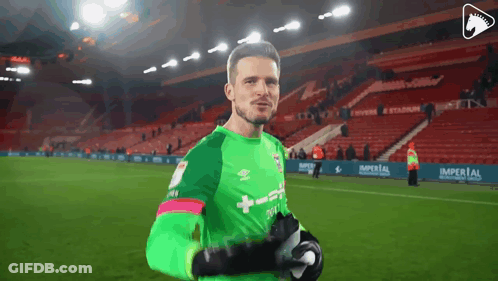 A Soccer Player Wearing A Green Jersey That Says Umbro GIF