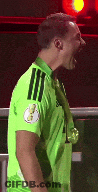 A Soccer Player Wearing A Green Jersey With A Gold Medal Around His Neck GIF
